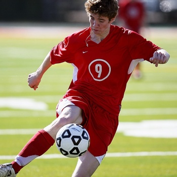 soccer, football, soccer player, sport, ball, game, player, field, grass, boy, action, soccer ball, sports balls, kicking, football player, school, soccer team, athlete, high school, green, nature, red, youth, action photo, kick